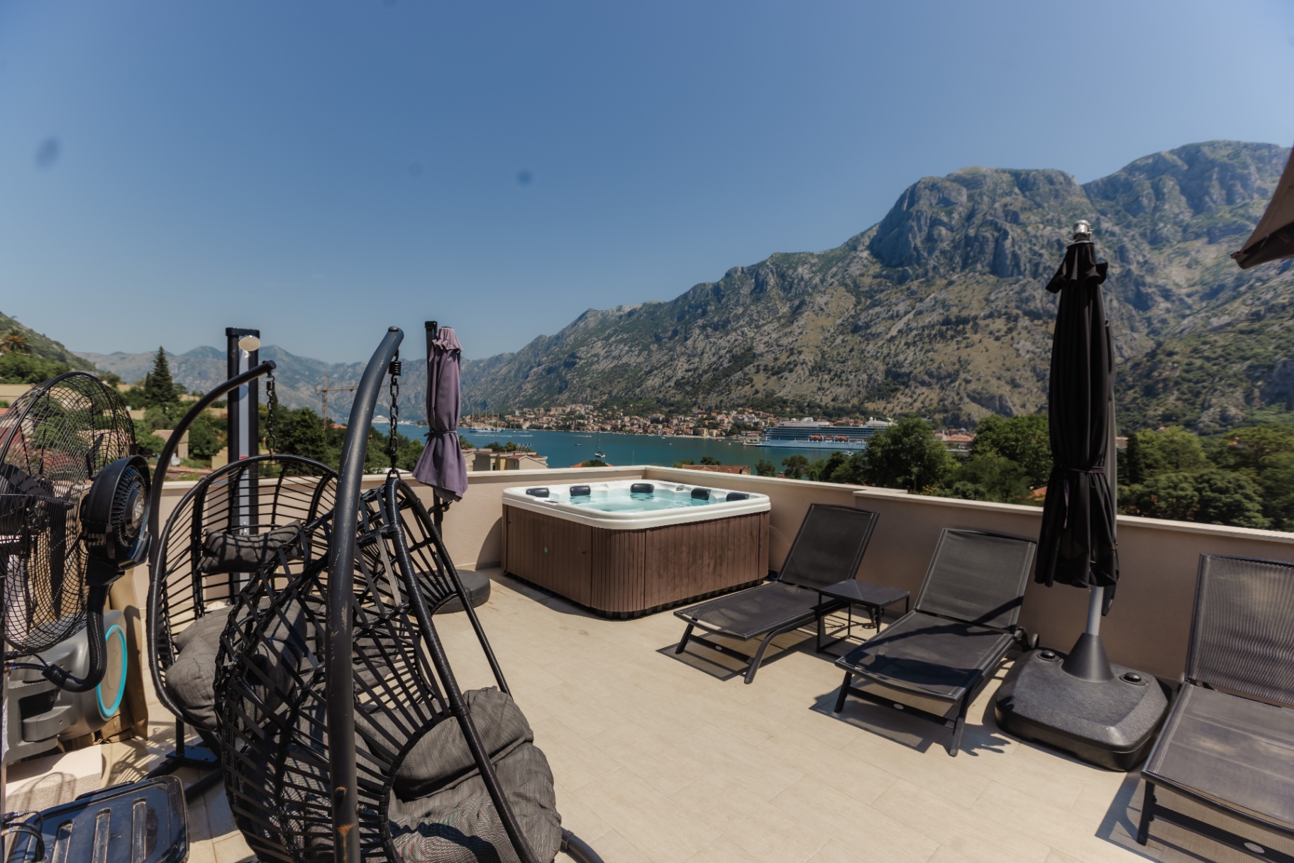 Rooftop terrace with hot tub and loungers