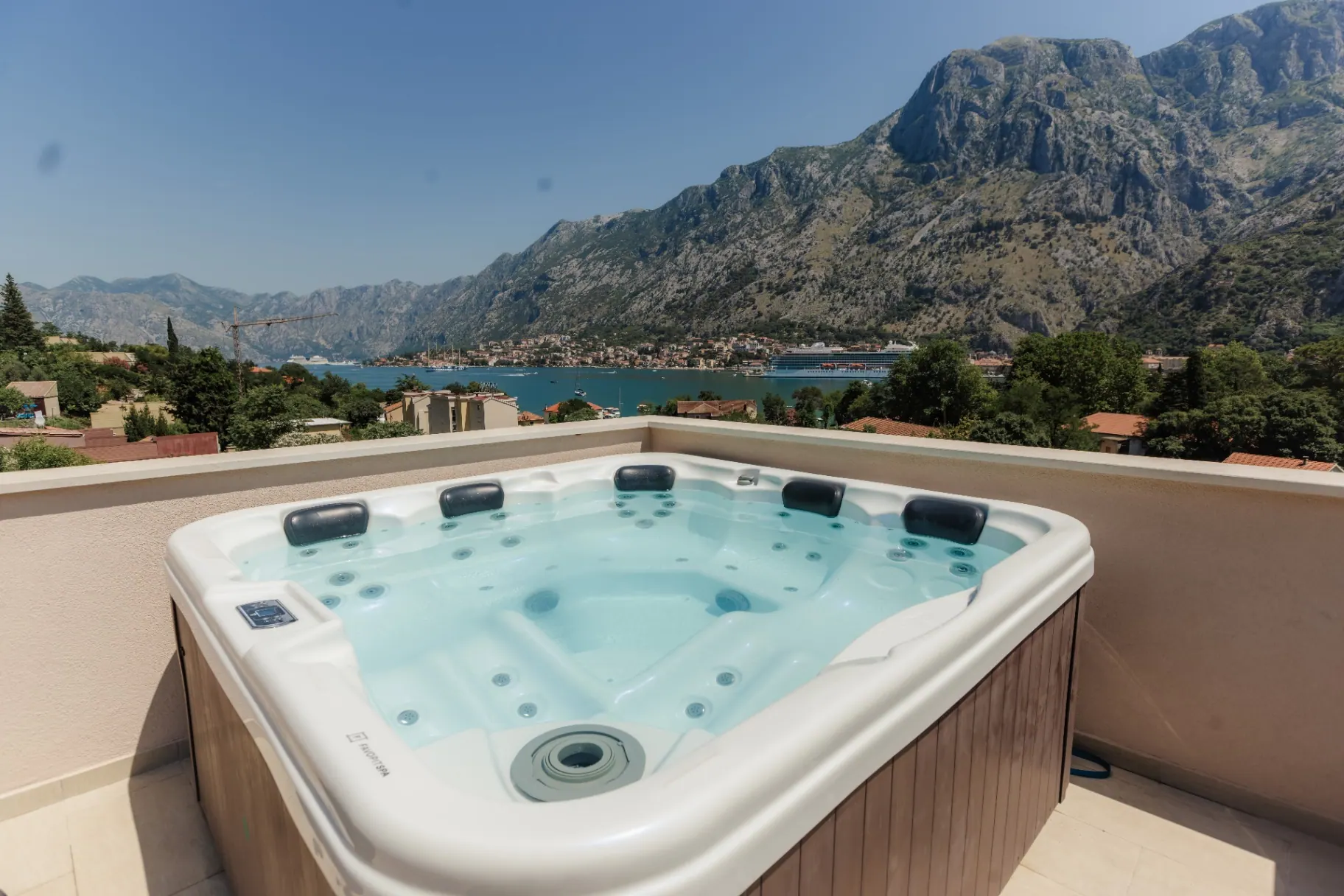 Rooftop hot tub with mountain backdrop